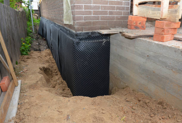 Happy homeowners after waterproofing job in Auburn